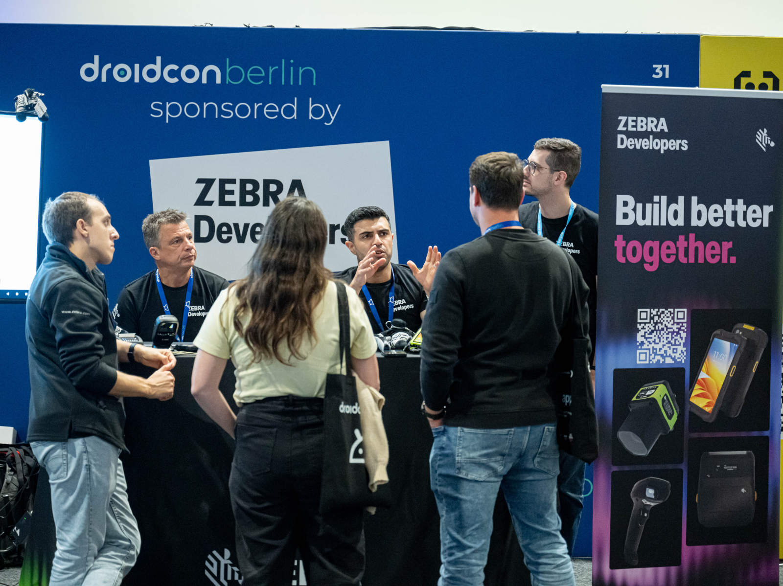 Zebra Developers at the Zebra booth talking to other devs.